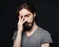 Stress, headache, health care and people concept - unhappy man touching his forehead Royalty Free Stock Photo