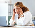 Stress, headache and tired business woman working on a report with a laptop in her modern office. Overworked, frustrated Royalty Free Stock Photo