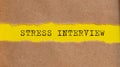 STRESS INTERVIEW message written under torn paper. Business, technology