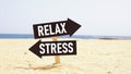 Stress and relax signposts on the sea beach Royalty Free Stock Photo