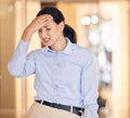 Stress, sick and tired business woman with a headache feeling sad and unhappy at work. Young female employee or worker Royalty Free Stock Photo