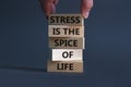 Stress spice of life symbol. Concept words Stress is the spice of life on wooden blocks. Businessman hand. Beautiful grey