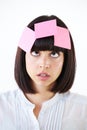 Stress, sticky note and the head of a business woman in studio isolated on a white background with a to do list. Face Royalty Free Stock Photo