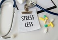 Stress Less text on card in doctor\'s office on desktop background, medical concept Royalty Free Stock Photo