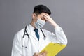 Stress and tired young Doctor Wear Medical Mask Royalty Free Stock Photo