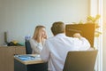 Stress woman talking to doctor psychiatrist in hospital,Discuss issue and find solutions to mental health problems