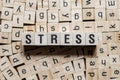 Stress word written on wood block