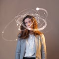 Stress at work, problems with multitasking . A young woman in a shirt and jacket Royalty Free Stock Photo
