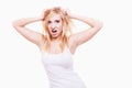 Stress. Young woman frustrated pulling her hair on white Royalty Free Stock Photo