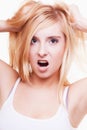 Stress. Young woman frustrated pulling her hair on white Royalty Free Stock Photo