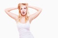 Stress. Young woman frustrated pulling her hair on white Royalty Free Stock Photo