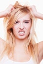 Stress. Young woman frustrated pulling her hair on white Royalty Free Stock Photo