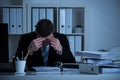 Stressed Accountant Working Late In Office Royalty Free Stock Photo
