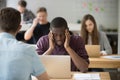 Stressed african-american entrepreneur having bad headache at wo Royalty Free Stock Photo