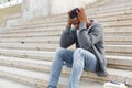 Stressed african-american man sitting on stairs Royalty Free Stock Photo