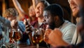 Stressed African Man Watching a Live Soccer Match on TV in a Sports Bar. Excited Fans Cheering and