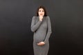Stressed or angry pregnant woman. Pregnancy mother problems on colored background isolated
