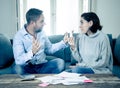 Stressed young couple having an argument over credit car debts payments and home finance Royalty Free Stock Photo