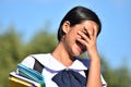 Stressed Or Ashamed Female Student Holding Books