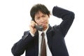 Stressed Asian businessman Royalty Free Stock Photo