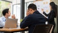 A stressed Asian businessman is in the meeting, worried and upset about his project outcomes Royalty Free Stock Photo