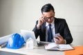 Stressed businessman read bad news by smartphone