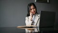 Stressed Asian businesswoman having a serious phone call with her business client Royalty Free Stock Photo