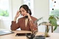 Stressed Asian businesswoman having a serious phone call with her business partner Royalty Free Stock Photo