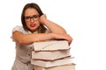 Stressed asian caucasian woman student learning in tons of books Royalty Free Stock Photo