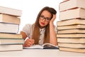 Stressed asian caucasian woman student learning in tons of books Royalty Free Stock Photo