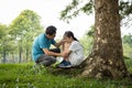 Stressed asian child girl sitting crying and thinking about problems at park,sad female teenage having psychological trouble with