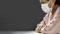 Stressed Asian Elderly woman wear white surgical mask quarantine at home. Worried Old Female with Coronavirus or Covid-19.