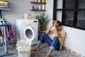 stressed asian Man doing laundry at home Royalty Free Stock Photo