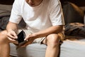 Stressed asian man having no money,holding empty wallet,Depressed male sitting in bed at night,financial trouble,bad economy, Royalty Free Stock Photo