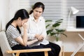 Stressed asian teenager girl crying,thinking about life problems at home,sad teenage female having psychological trouble with Royalty Free Stock Photo