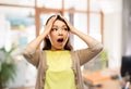 Stressed asian woman holding to her head at office Royalty Free Stock Photo