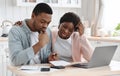 Stressed Black Couple Calculating Family Budget In Kitchen, Suffering Financial Crisis Royalty Free Stock Photo