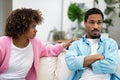 Stressed black woman saying sorry after quarrel to frustrated husband Royalty Free Stock Photo