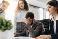 Stressed boss having problem at business meeting in office Royalty Free Stock Photo