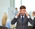 Stressed buisnessman or teacher having headache Royalty Free Stock Photo