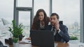 Stressed business couple working on laptop at new project feeling nervous. Royalty Free Stock Photo