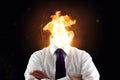 Stressed business man with burning head