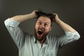 Stressed business man. Caucasian man yeling and pulling hair. Angry business Royalty Free Stock Photo