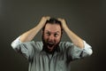 Stressed business man. Caucasian man yeling and pulling hair. Angry business Royalty Free Stock Photo