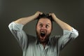 Stressed business man. Caucasian man yeling and pulling hair. Angry business Royalty Free Stock Photo