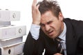 Stressed business man has bad headache in office