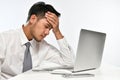 Stressed business man resting his head in his hand Royalty Free Stock Photo