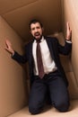Stressed businessman in box Royalty Free Stock Photo