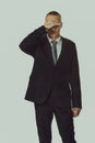 Stressed businessman covering his face Royalty Free Stock Photo
