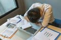 Stressed businessman fall asleep on messy office desk Royalty Free Stock Photo